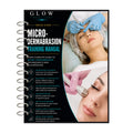 A spiral-bound training manual titled 'GLOW Beauty Case Micro-Dermabrasion Training Manual' shown against a white background. The cover features a black background with white and teal text, and two photos of a woman receiving facial micro-dermalization treatment with a blue gloved hand visible.